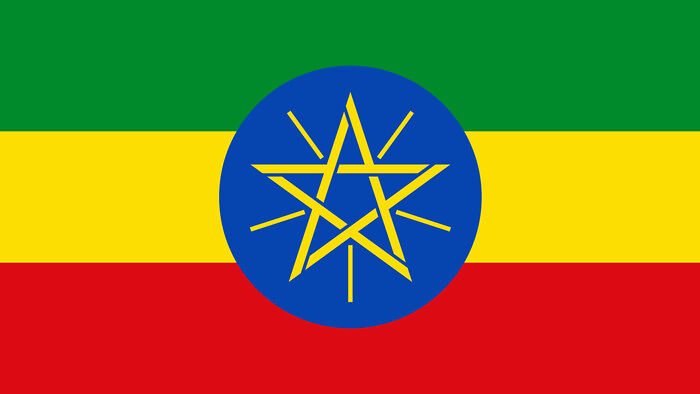 Znajdująca się pośrodku flagi pięcioramienna gwiazda symbolizuje równość wszystkich zamieszkujących ten kraj grup etnicznych, płci i wyznań. Jaki to kraj?